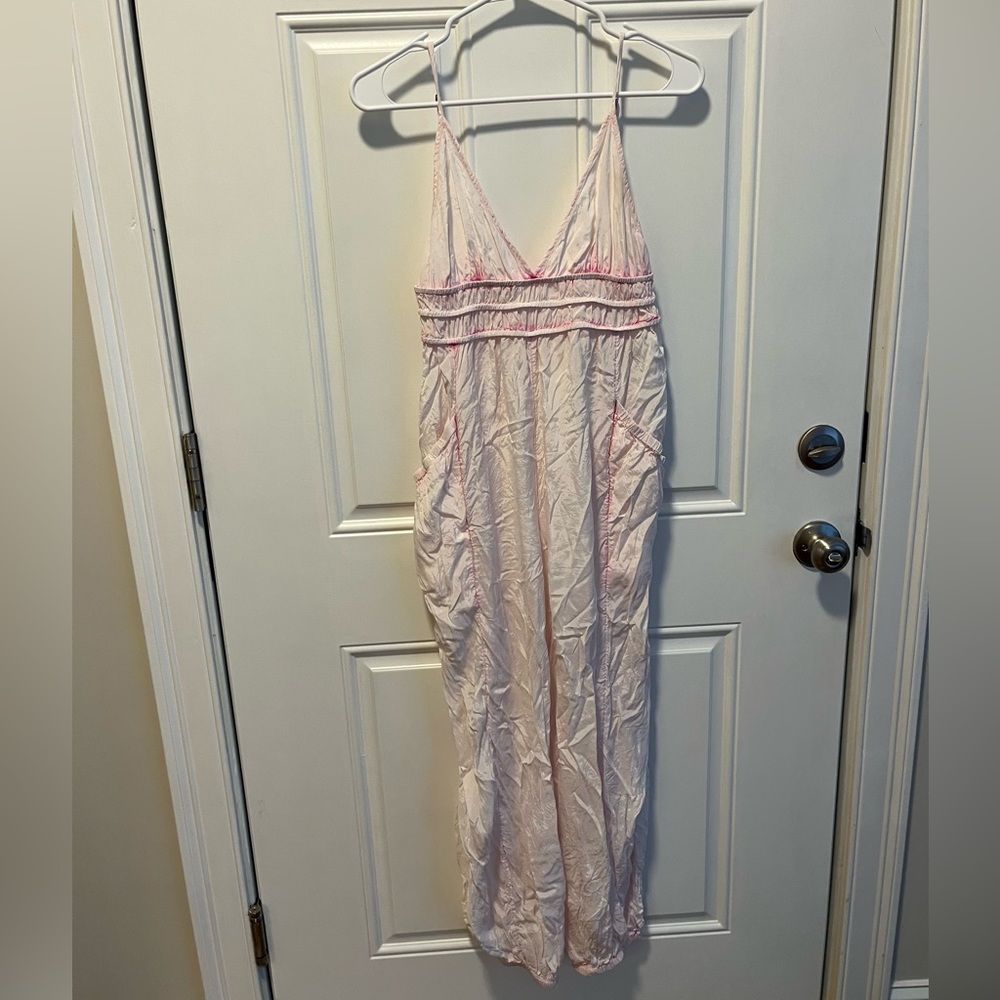 Free People pink tie dye jumpsuit with pockets and adjustable straps